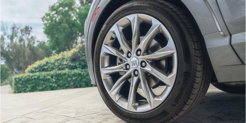 18-inch Gloss Black alloy wheel on the 2026 Buick Encore GX Sport Touring